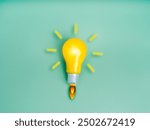 Business startup, creative idea, inspiration, education knowledge and learning, innovation concept. Yellow lightbulb as spaceship or rocket launch with fire smoke graphic on light green background.