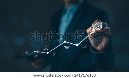 Business startup and investment goals concept. Businessman is touching the growing business graph. Planning and starting corporate business start up, Rocket soars with speed to hit the growth target.