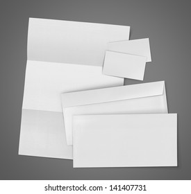 Business Stationary Set. Envelope, Sheet Of Paper And Business Card On Gray Background