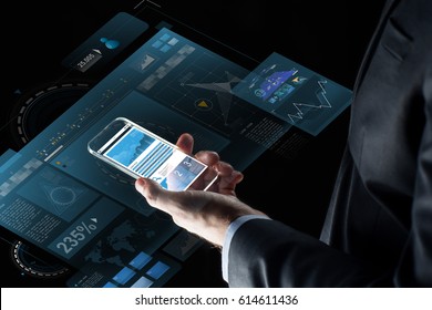 business, statistics, people and future technology concept - close up of businessman hand with charts on transparent smartphone screen and virtual projections over black background - Powered by Shutterstock