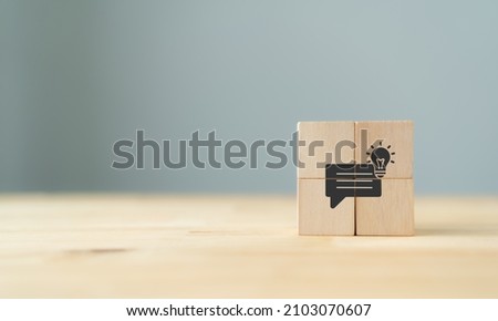 Business strategy from customer feedback and suggestion concept.  Customer centric. Team brainstrom and strategy planning. Wooden cube with feedback, idea, strategy symbols on grey backaground. Banner