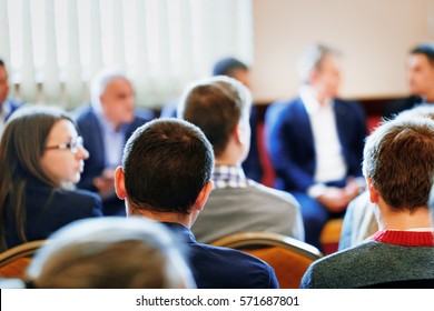 Business Style Dressed CEO Lead The Team Building Meeting In Small Class Room. Education, Business Entrepreneurship Concept. Business Conference And Presentation. Selective Focus At Rear View Student.