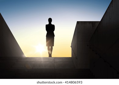 Business, Success, Achievement And People Concept - Silhouette Of Woman Standing On Stairs Over Sun Light Background