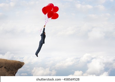 business success concept businessman flying upward with helium balloons