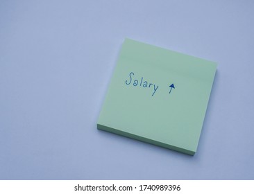 Business Success Concept Sticky Note With Hand Writing Of Salary Increase And Raise Message