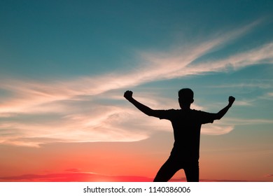 business, success, leadership, achievement and people concept - The success of young men - silhouette over evening sky - Shutterstock ID 1140386006