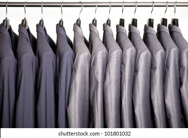 Business Suits Hanging On A Rack