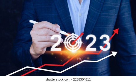 Business target and goal 2023 icon, hand pointing holding 2023 virtual screen and up arrow, Start new year 2023 with a goal plan, action plan, strategy, new year business vision. - Shutterstock ID 2238304811