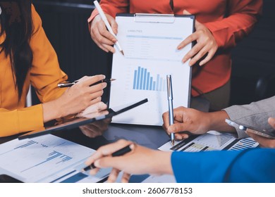 Business Team Analyzing Financial Data in Modern Office
