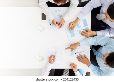 Business team analyzing financial documents - Powered by Shutterstock