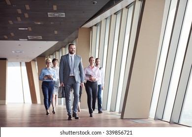 Business Team, Businesspeople  Group Walking At Modern Bright Office Interior