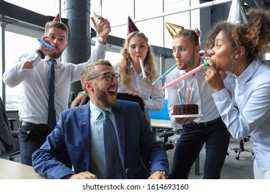 Business Team Celebrating A Birthday Of Collegue In The Modern Office