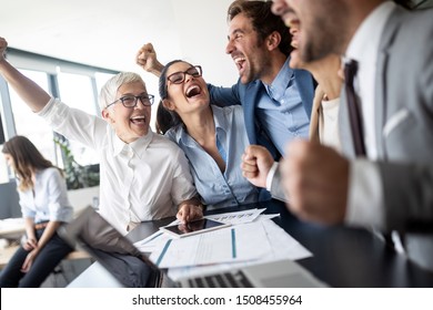 Business Team Celebrating A Good Job In The Office