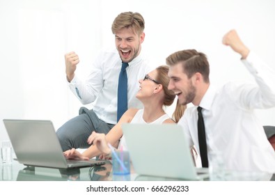 Business Team Celebrating A Triumph With Arms Up