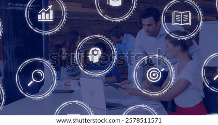 Business team collaborating at table with data processing image overlaid. Teamwork, collaboration, brainstorming, data analysis, technology, innovation