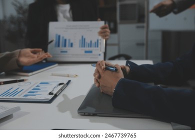 Business team collaboration discussing working analyzing with financial data and marketing growth report graph in team, presentation and brainstorming to strategy planning making profit of company. - Powered by Shutterstock