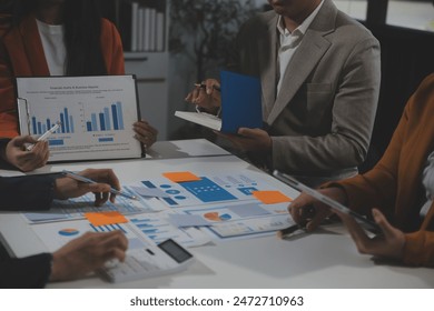 Business team collaboration discussing working analyzing with financial data and marketing growth report graph in team, presentation and brainstorming to strategy planning making profit of company. - Powered by Shutterstock