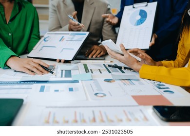 Business team collaboration discussing working analyzing with financial data and marketing growth report graph in team, presentation and digital tablet, laptop - Powered by Shutterstock