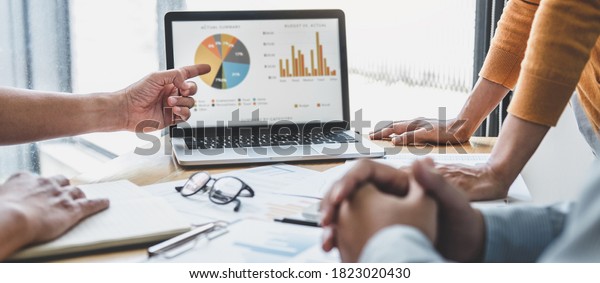 Business team collaboration discussing working
analyzing with financial data and marketing growth report graph in
team, presentation and brainstorming to strategy planning making
profit of company.
