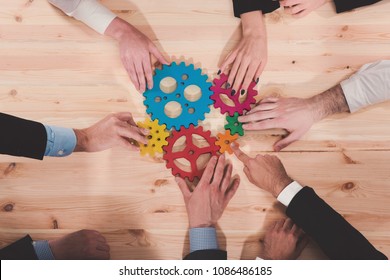 Business Team Connect Pieces Of Gears. Teamwork, Partnership And Integration Concept