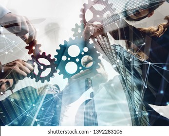 Business Team Connect Pieces Of Gears. Teamwork, Partnership And Integration Concept. Double Exposure With Network Effects