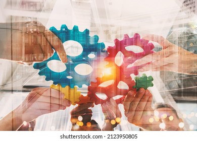Business team connect pieces of gears like a teamwork and partners - Shutterstock ID 2123950805