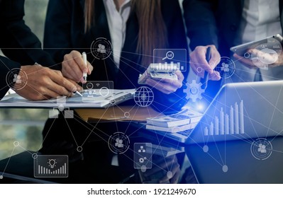 Business Team Corporate Marketing Working Concept. Business partners using laptop and digital tablet with virtual interface icons network diagram, Blurred background. - Powered by Shutterstock