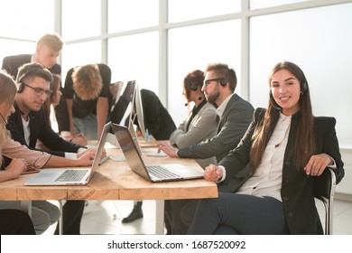 Business Team Discussing Data Coming To The Office.