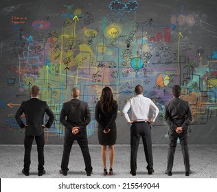 Business team drawing a new complex project - Shutterstock ID 215549044