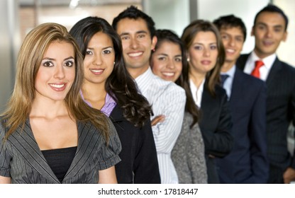 Business team full of young entrepreneurs with a beautiful girl leading - Shutterstock ID 17818447