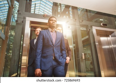 Business Team Going On Elevator And Talking