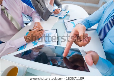 Business team having roundtable discussion at the office viewed below