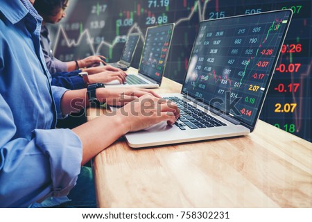 Business Team Investment Entrepreneur Trading working on Laptop Stock market exchange information and Trading graph