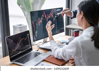 Business team investment working with computer, planning and analyzing graph stock market trading with stock chart data, business financial investment and technology concept.