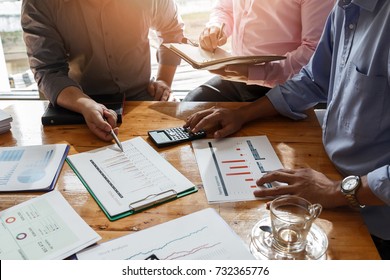 Business team meeting and discussing project plan. Businessmen discussing together in meeting room. Professional investor working with business project together. Finance managers task.