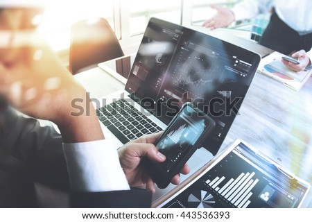 Business team meeting. Photo professional investor working new start up project. Finance task.Digital tablet laptop computer smart phone using, Sun flare effect                               