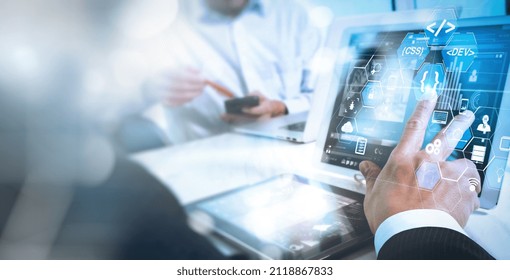 Business team meeting present.Coding software engineer developer work with augmented reality dashboard computer icons of scrum agile development and code fork and versioning responsive cybersecurity.