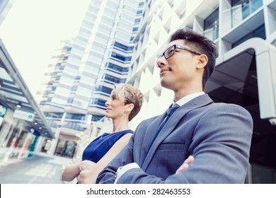 Business team members standing next to each other in business district - Shutterstock ID 282463553