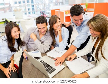 Business Team At The Office Working On A Laptop