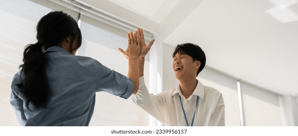 business team people give high five happy excited in teambuilding celebrate corporate teamwork concept - Powered by Shutterstock