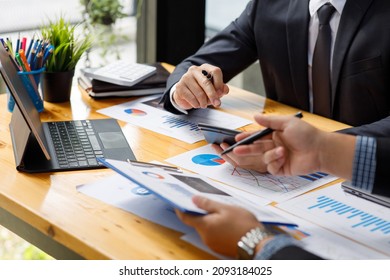 Business team present. Business man hands hold documents with financial statistic stock photo, discussion, and analysis report data the charts and graphs. Finance concept