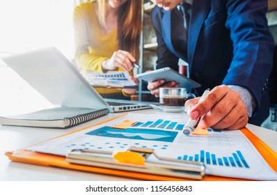 Business team present. professional investor working new start up project. Finance managers meeting.using smart phone and laptop and digital tablet computer in modern office.  - Shutterstock ID 1156456843