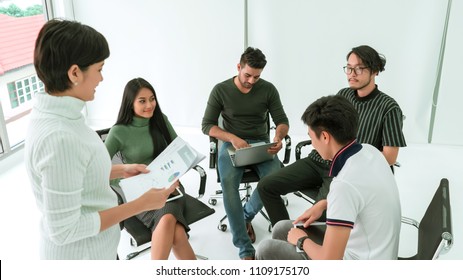 Business Team Sitting In A Circle Together For Sharing Business Ideas. Concept Of Brainstorming, War Room, Meeting Teamwork And Dashboard.