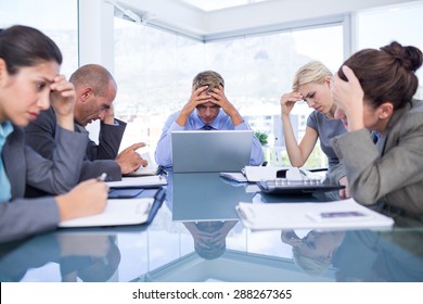 Business team smiling at camera in the office - Shutterstock ID 288267365