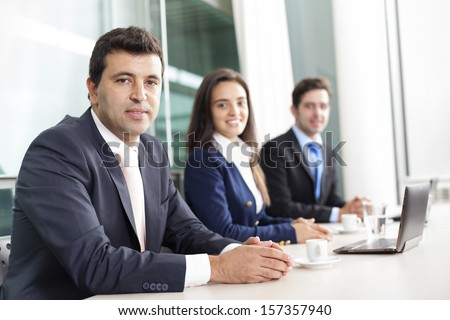 Business team smiling at the office, lined up