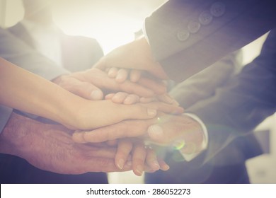 Business Team Standing Hands Together In The Office