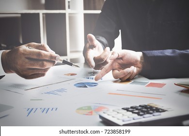 Business Team Support And Meeting Concept. Group Of Investor Working And Pointing At Financial Paperwork Finance Task.