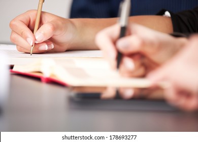 Business Team Taking Notes On A Meeting