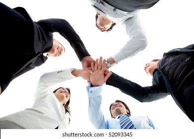 Business Team With Their Hands Together In The Middle Isolated Over White