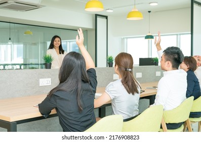 Business team training in progress with trainees raising hands to ask questions. Co working office setting. - Shutterstock ID 2176908823